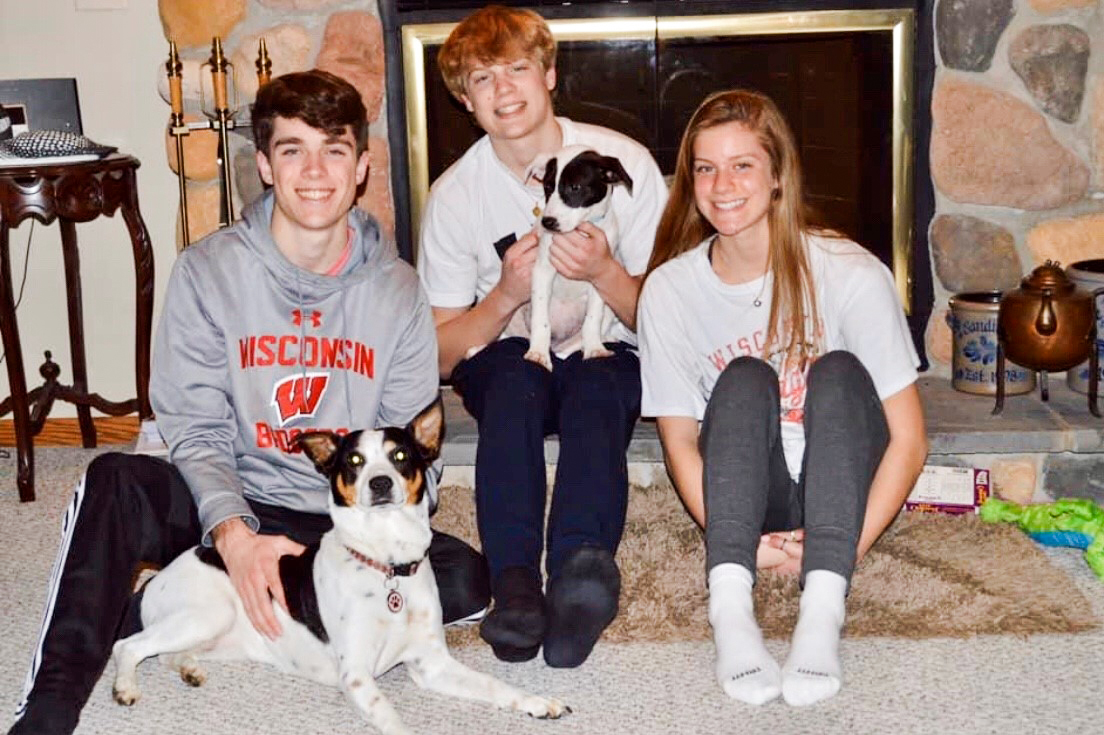 The Sandine family with 4-month-old recently rescued pup, Rosie and siblings (from left) James, Derek, Linnea and the family’s 5-year-old dog, Roxy. Both dogs were adopted.